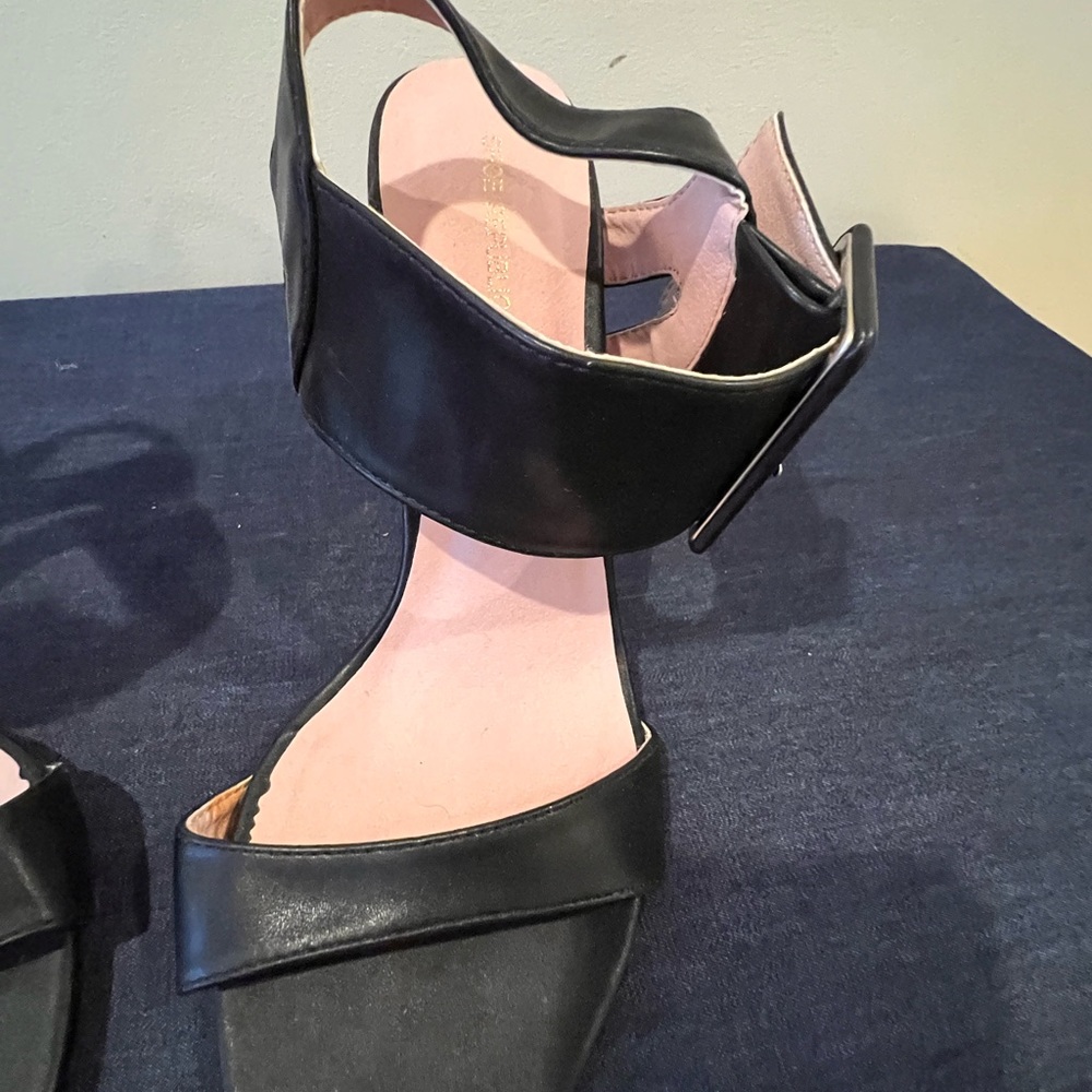 Black leather, large buckle strapped sandals.